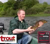 Fisherman holding trout with Trout Fisherman and Trout Masters 2008 Competition logos