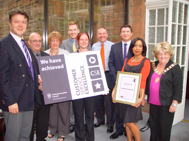staff being presented with the CSE certificate